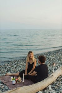 Couple on rocky beach